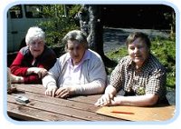 Three IDEAs members at a table